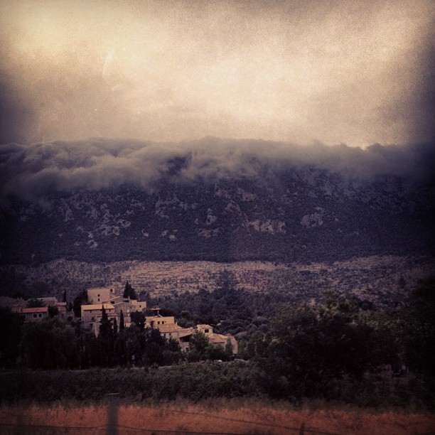 Grainy image of an old village in the mountains