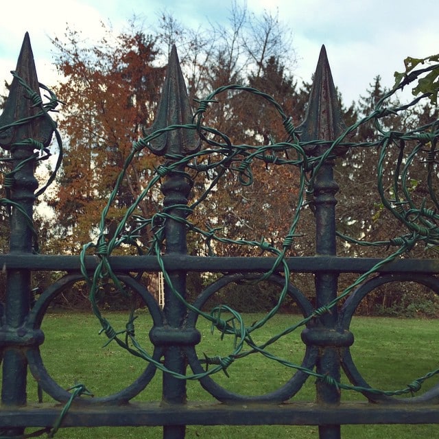 A fence with some barb wire