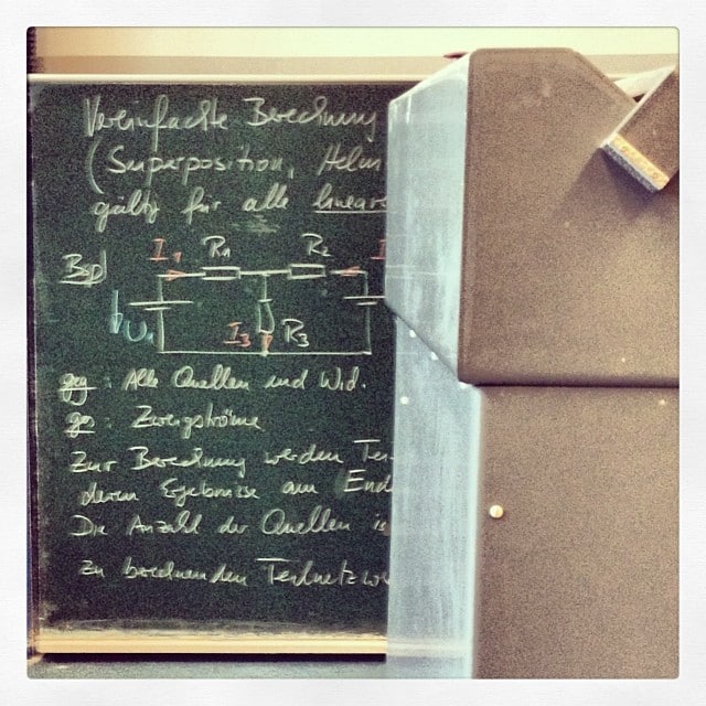 Chalk board with physics diagrams