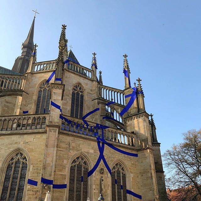 A church with a giant artwork comprised of giant blue circles