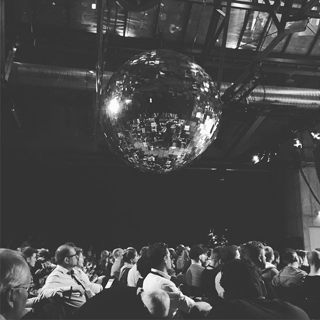 Giant disco ball above an audience