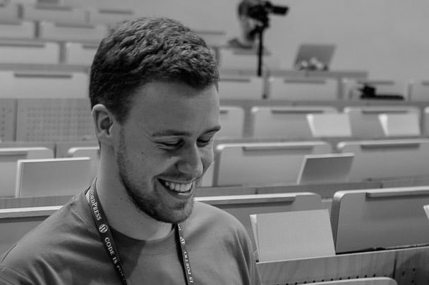 Simon in an empty auditorium